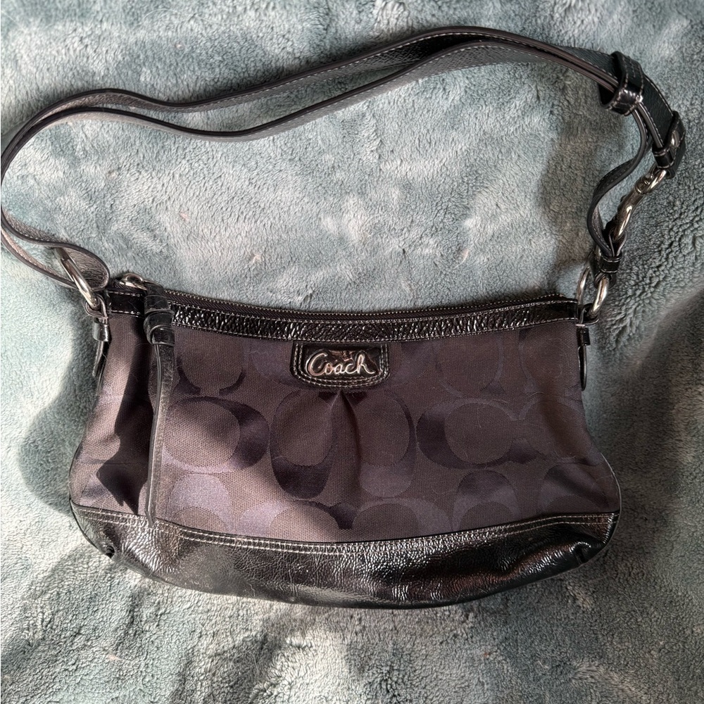 Coach Black Shoulder Bag with Adjustable Strap and Pleated Design